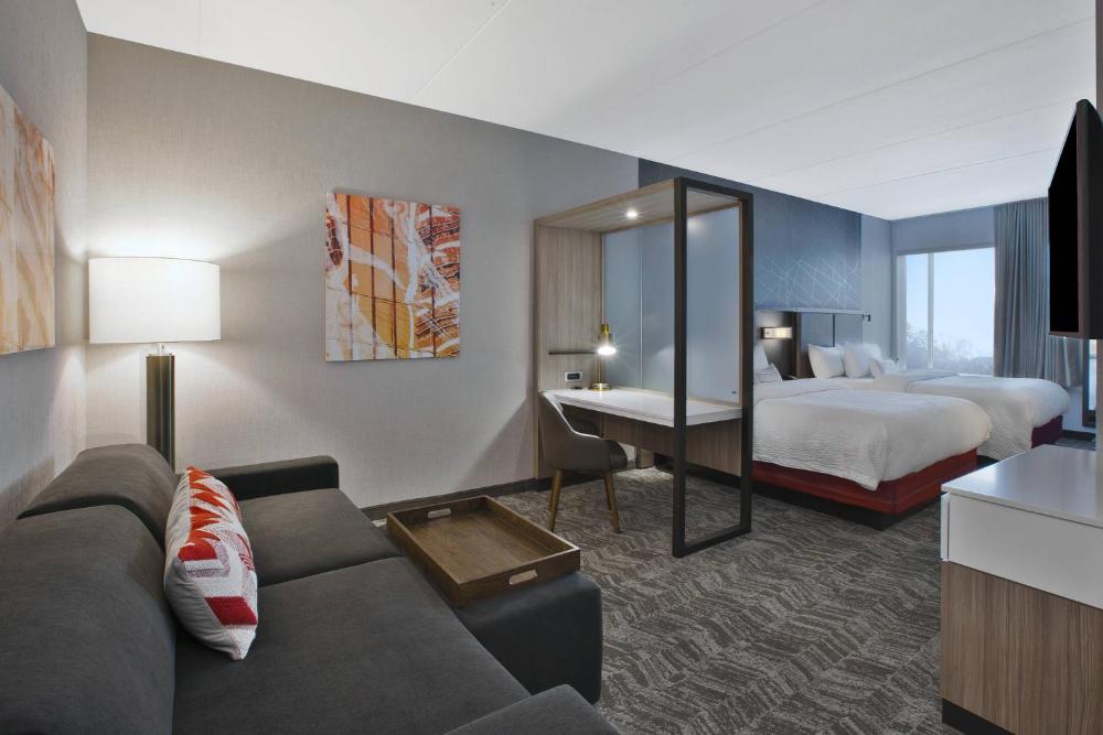 Queen Suite with Two Queen Beds and Trundle Sofa - Communication Assistance interior